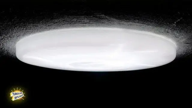 White flat ceiling lens of a tubular skylight